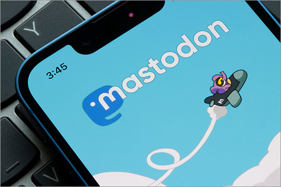 Mastodon logo is seen on the login page of the Mastodon app on an iPhone. Mastodon, a decentralized platform, rapidly gains users after Elon Musk's Twitter takeover.